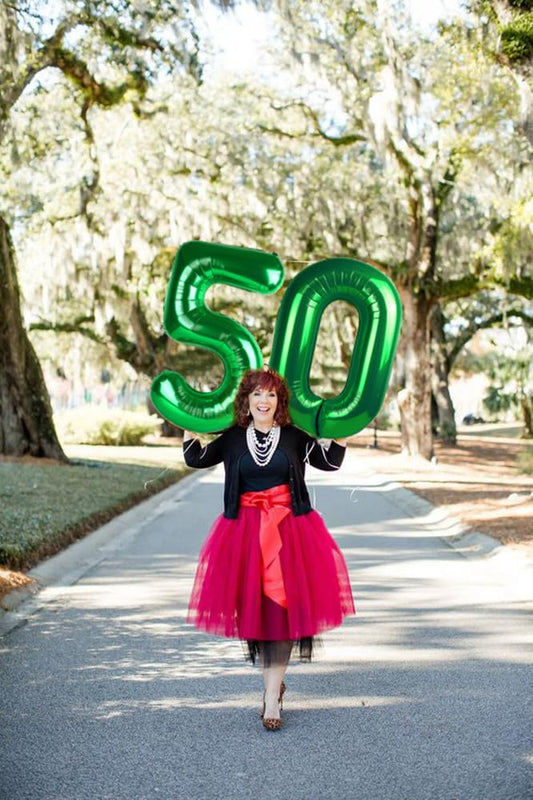Mluchee 40-inch number balloons in a dynamic hero shot, great for big party displays.