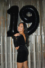 Mluchee birthday decor doubles as a photo booth prop