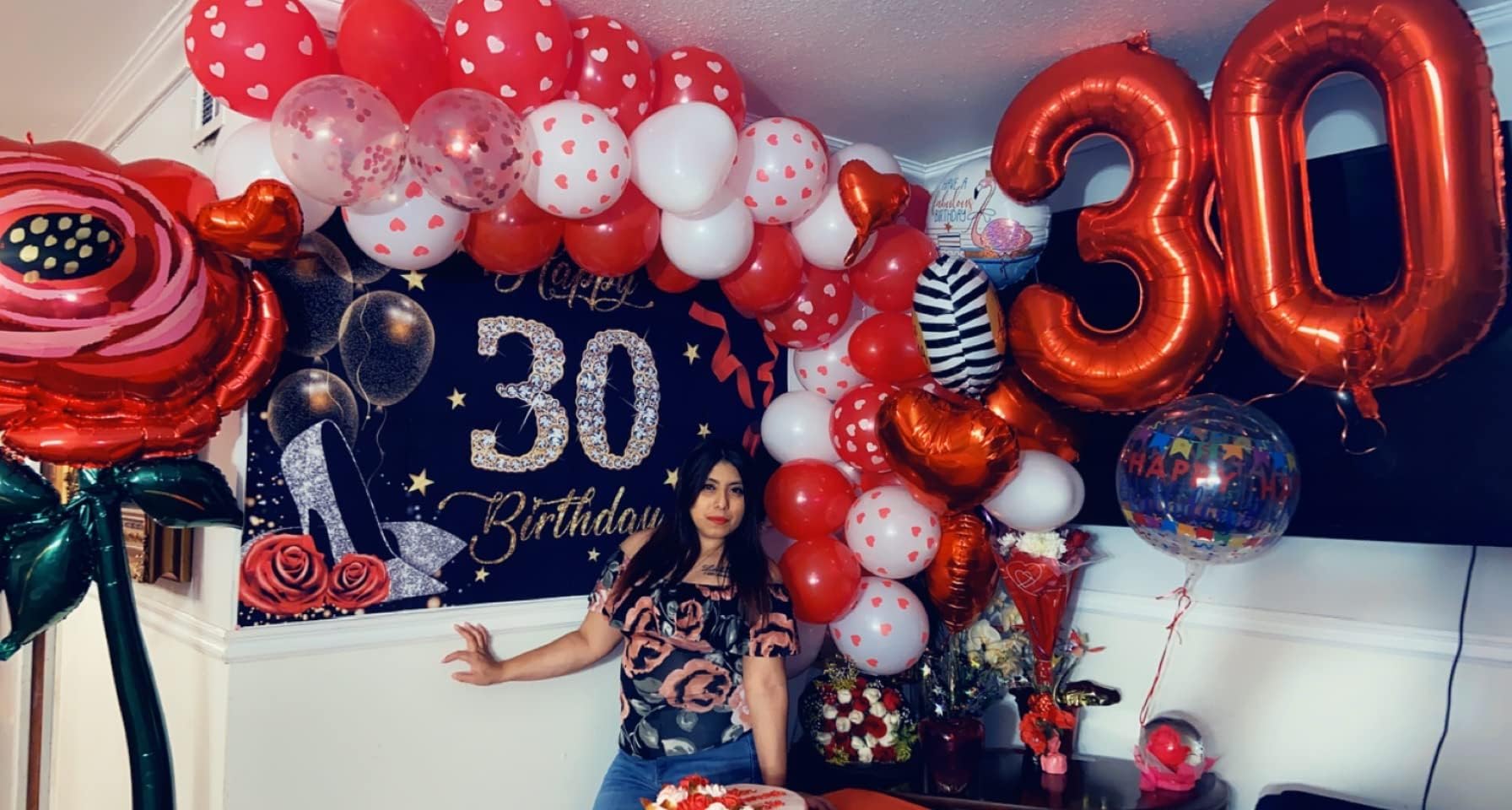 Mluchee giant red number balloon decor for festive settings and photo booths.