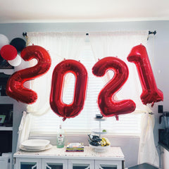 Mluchee Number 0 balloon, 40-inch side view, vibrant centerpiece for celebrations.