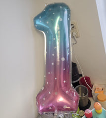 Mluchee 40-inch Number 0 balloons used as wall decor for a celebration