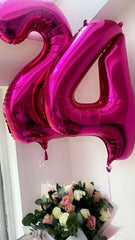 Mluchee number 7 balloon creates a striking photo booth prop.