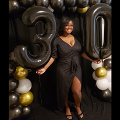 Mluchee 7 number balloon for engagements and weddings as a backdrop.