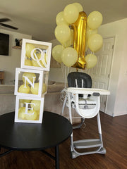 Mluchee 40-inch gold number balloon as wall decor in a party setup