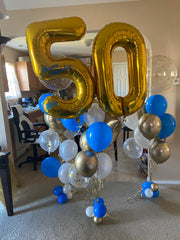 Mluchee number balloons wall display demonstrates dramatic event decor