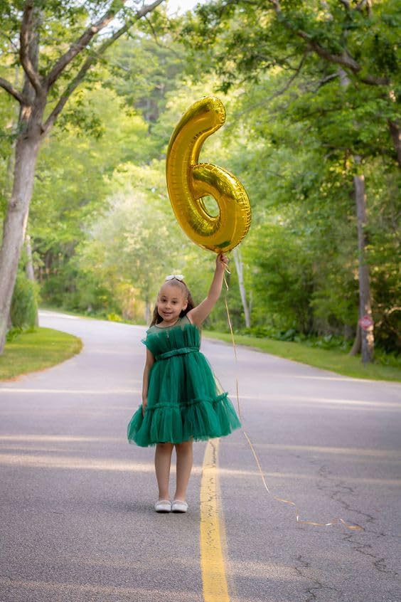 Mluchee number 6 balloon used as photo booth prop
