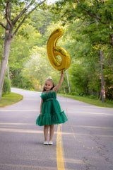 Mluchee number 6 balloon used as photo booth prop
