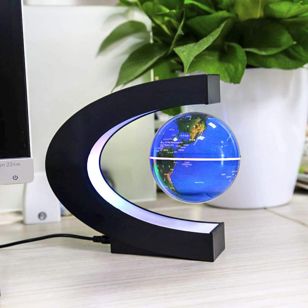 Floating globe by MOKOQI rotates slowly as a striking desk centerpiece.