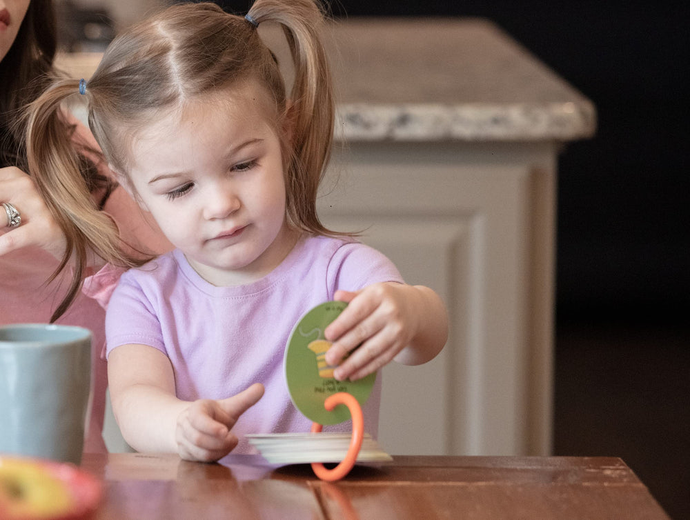 MOLLYBEE KIDS scavenger hunt card showing a lamp, sparks observation and color discussion.