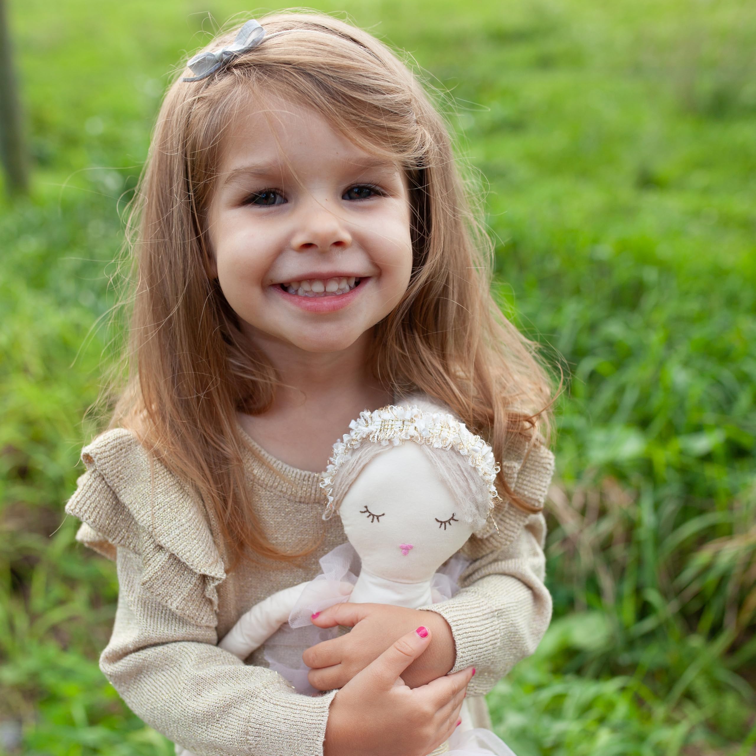 MON AMI Ballerina doll decorative presence enhances a kid's reading nook or nursery.