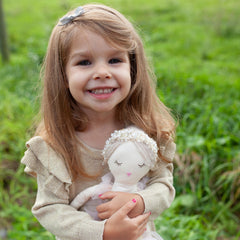 MON AMI Ballerina doll decorative presence enhances a kid's reading nook or nursery.