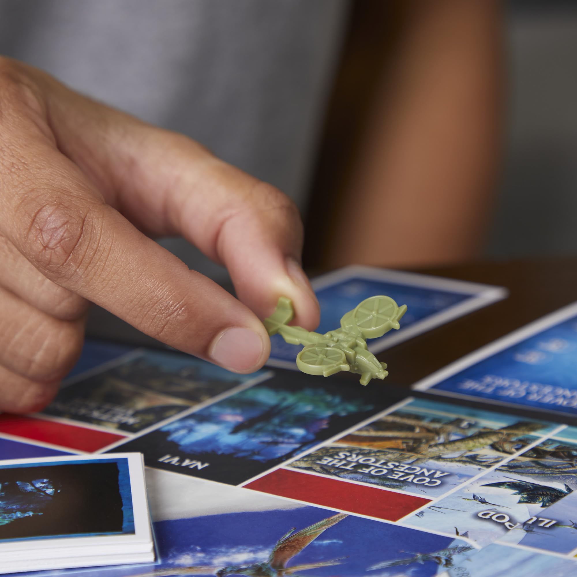 Monopoly Avatar Edition Na’vi character tokens representing clan members.