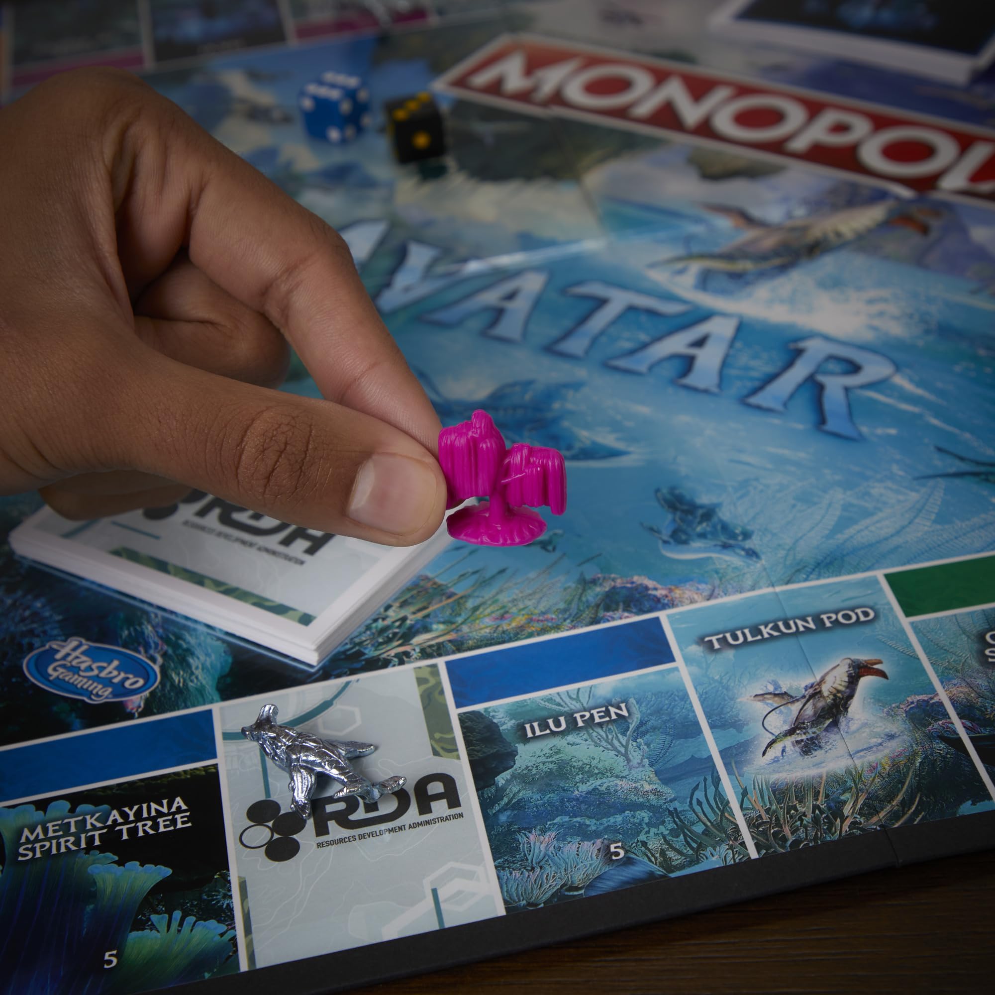 Monopoly Avatar Edition RDA Scorpion card introducing twists during play.