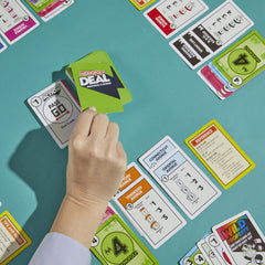 Monopoly Deal card game quick play banner emphasizes 15-minute sessions.