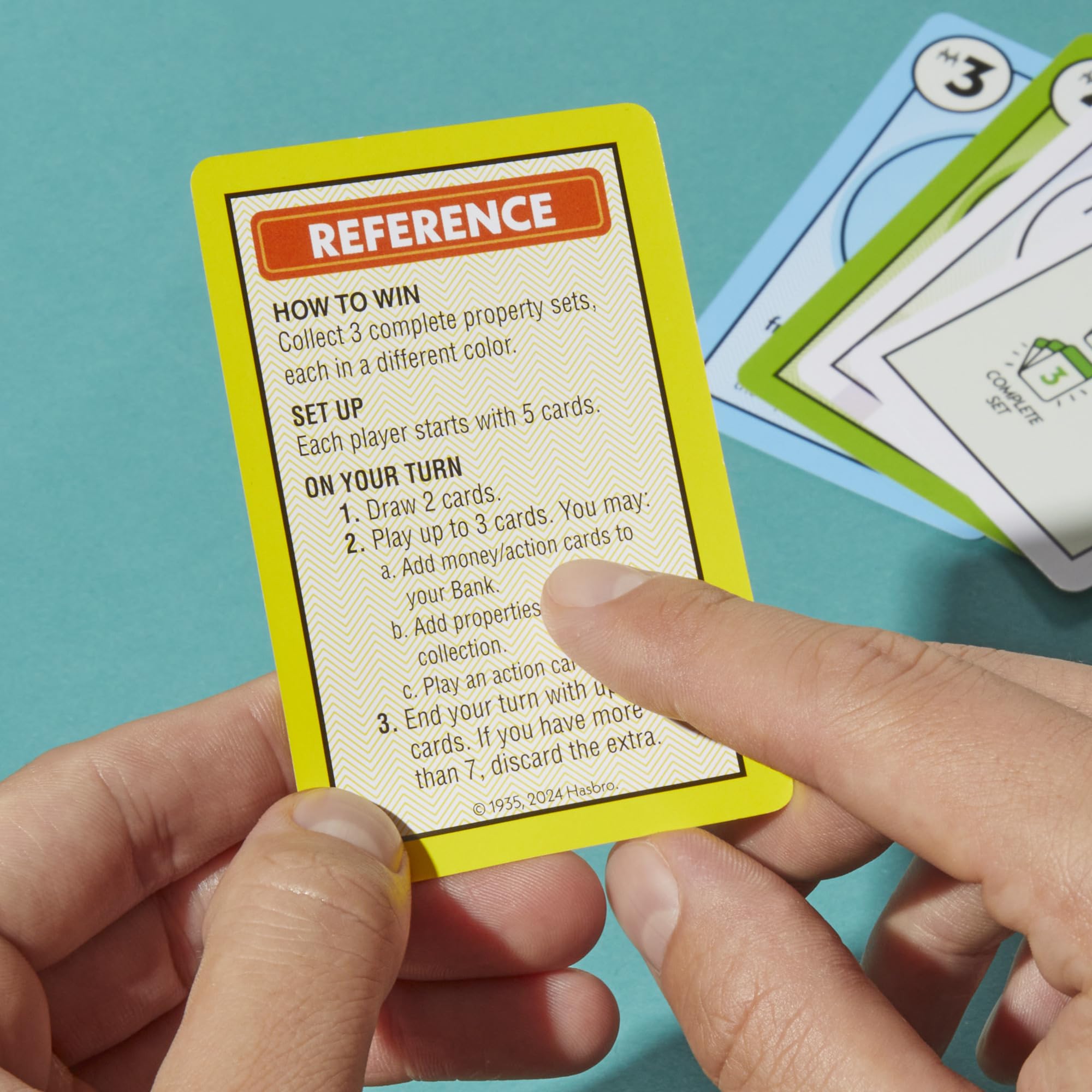Monopoly Deal card game three property sets a winning condition in sight.