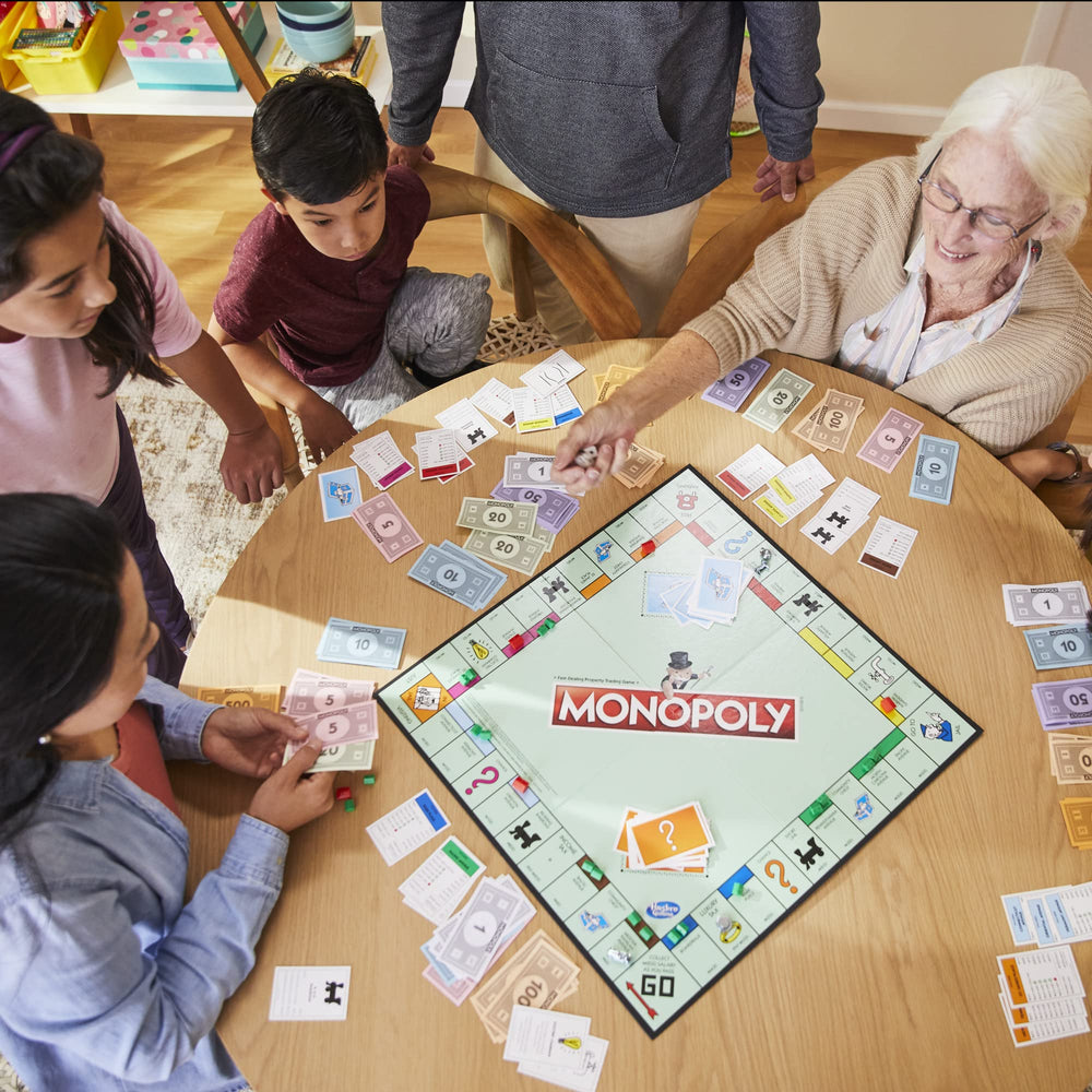 Monopoly family game night scene captures players trading and cheering