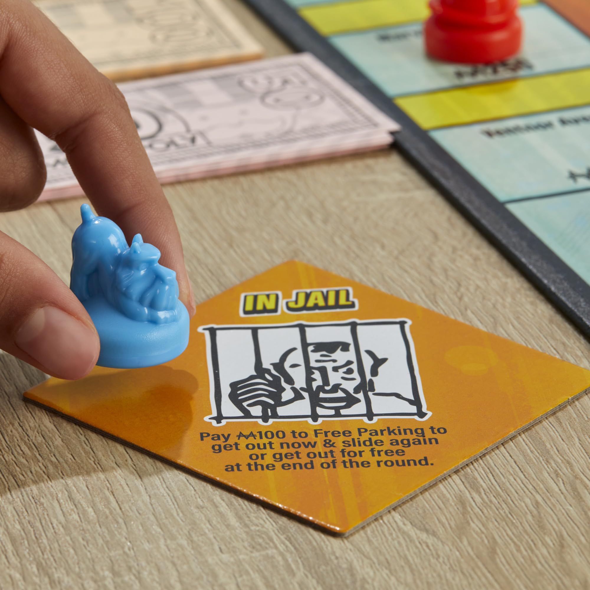 Monopoly Knockout cash tracks show end-of-round rewards and risk