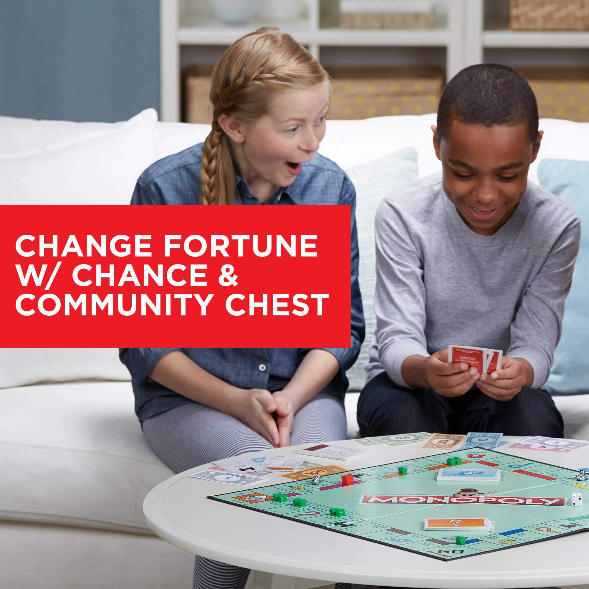 Monopoly Penguin token near Chance cards suggests strategic planning