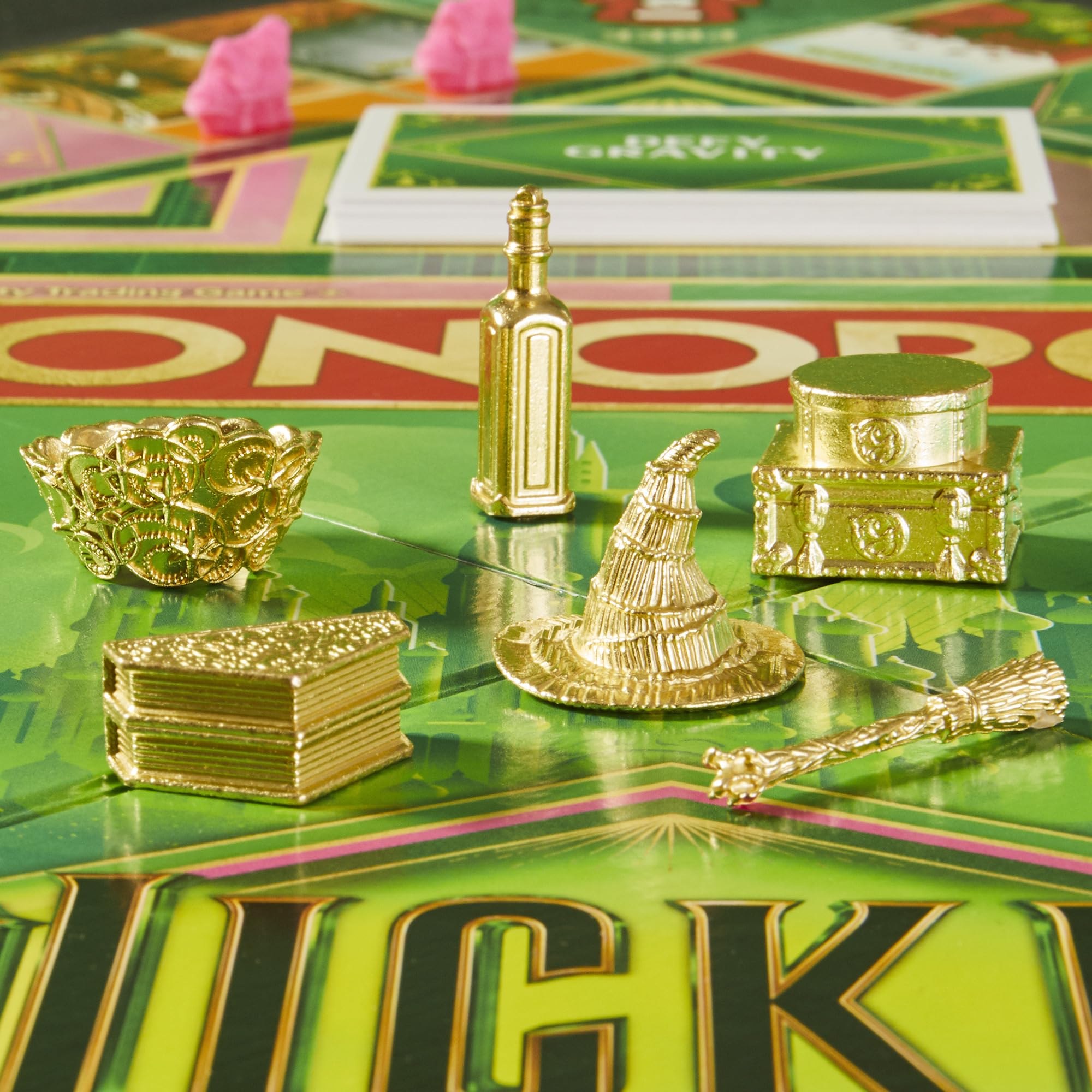 Monopoly Wicked Edition Elphaba broom token highlights swift moves on the board.