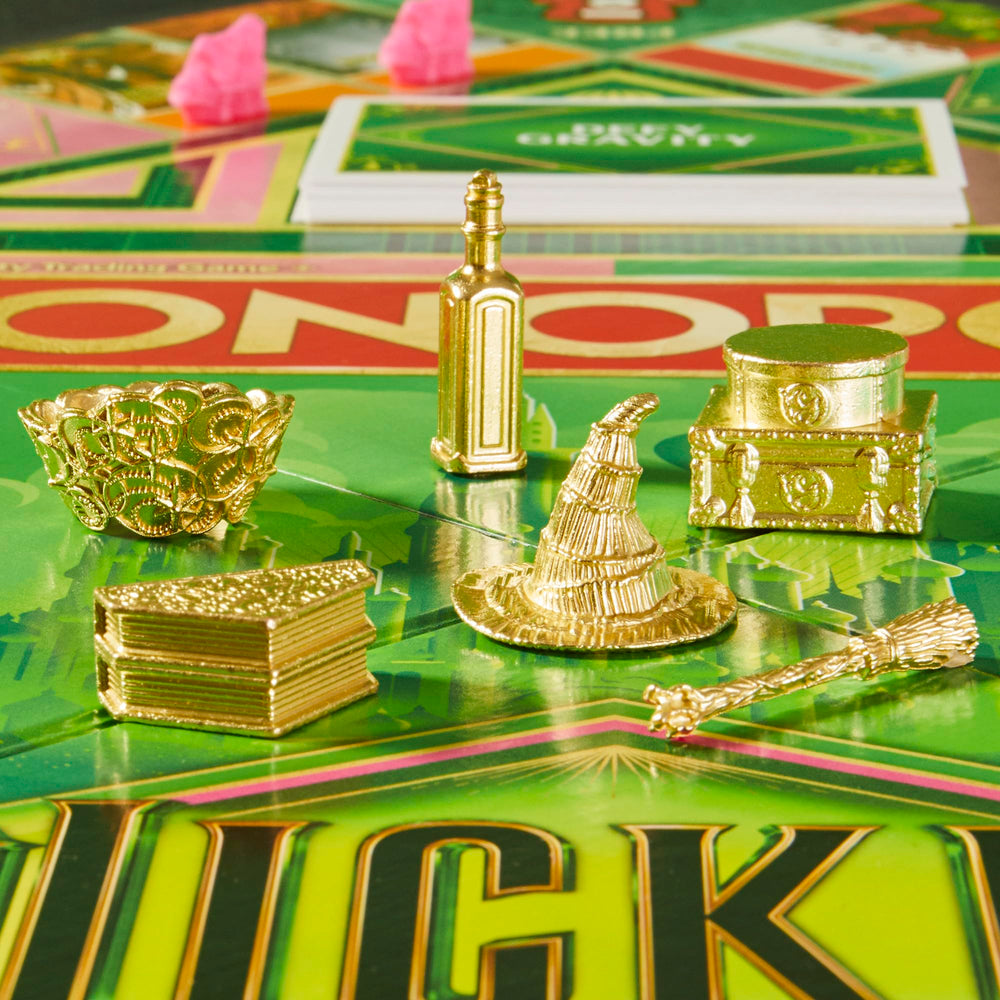 Monopoly Wicked Edition Elphaba broom token highlights swift moves on the board.