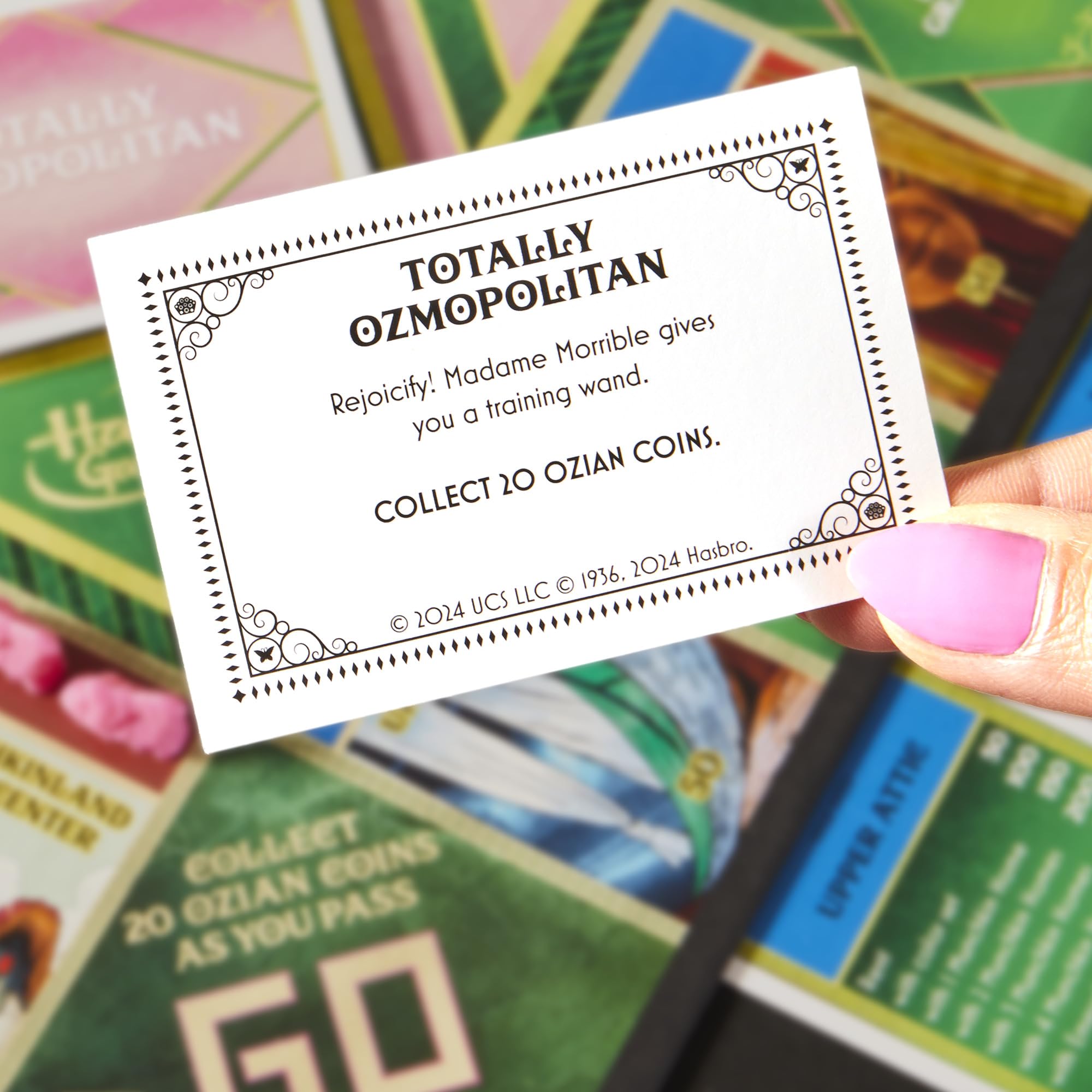 Monopoly Wicked Edition munchkin homes on the board illustrate Oz locations.
