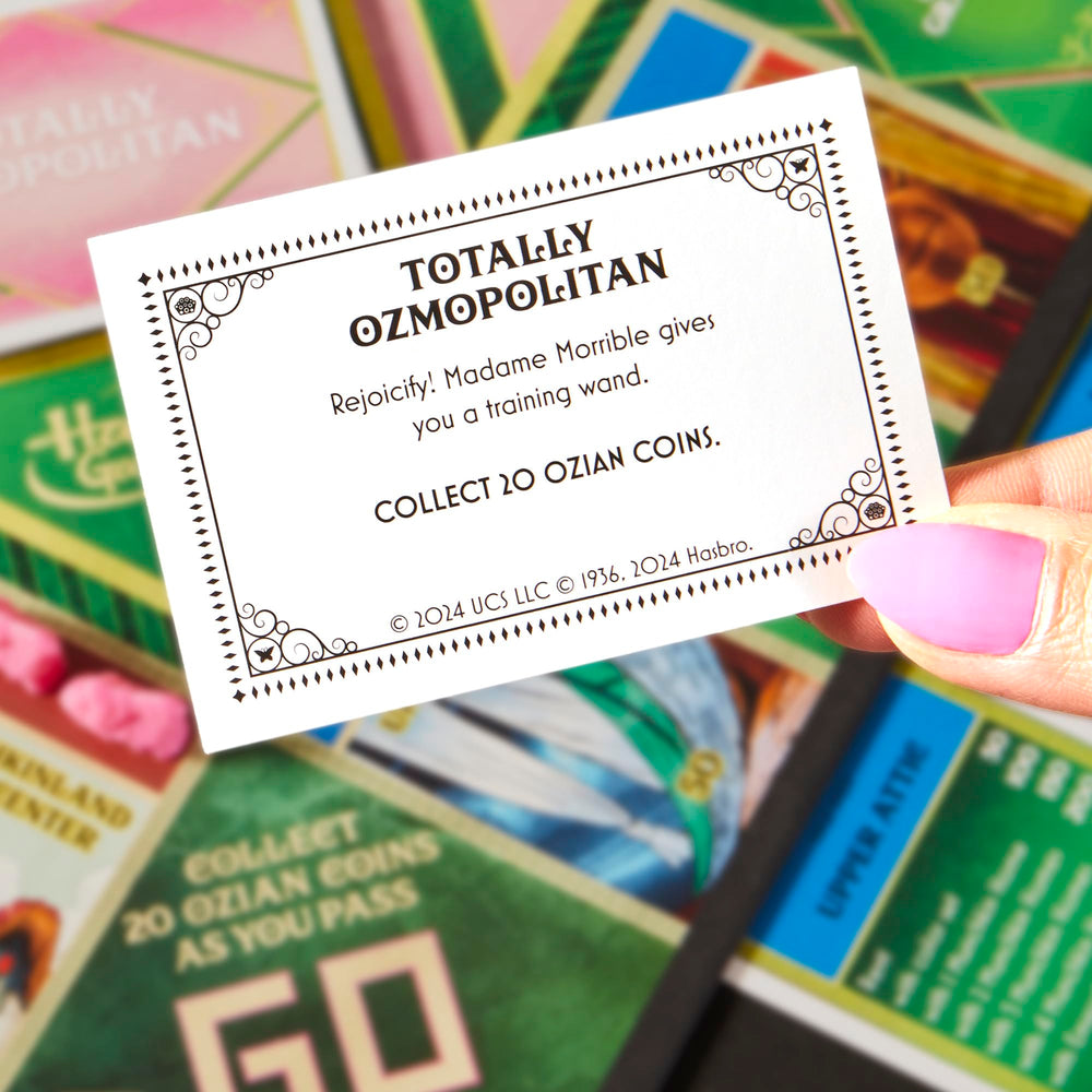 Monopoly Wicked Edition munchkin homes on the board illustrate Oz locations.