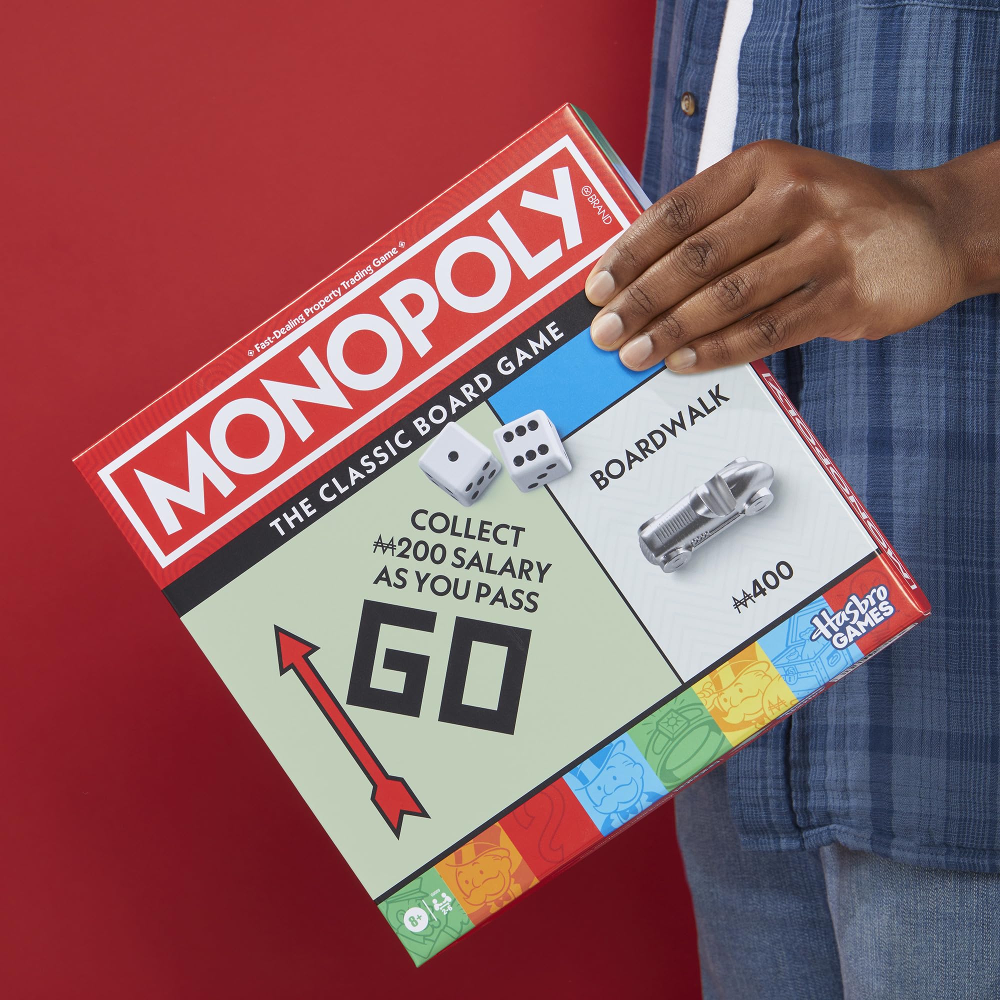 Monopoly wide game board design improves visibility for all players.