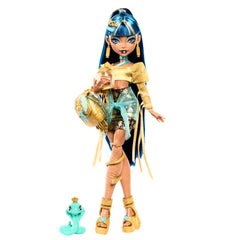 Monster High Cleo De Nile doll wearing golden blouse and layered skirt for regal play