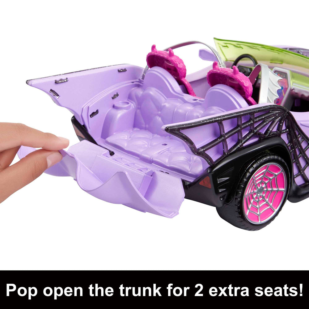 Monster High Ghoul Mobile interior shows batwing-shaped seatbelts for spooky safety-themed play