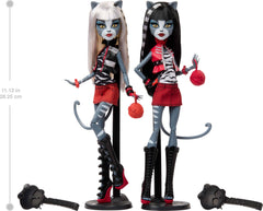 Monster High Meowlody and Purrsephone outfits close-up show cropped vests and vibrant miniskirts.