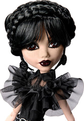 Monster High Wednesday doll in gothic black gown with detailed accessories.