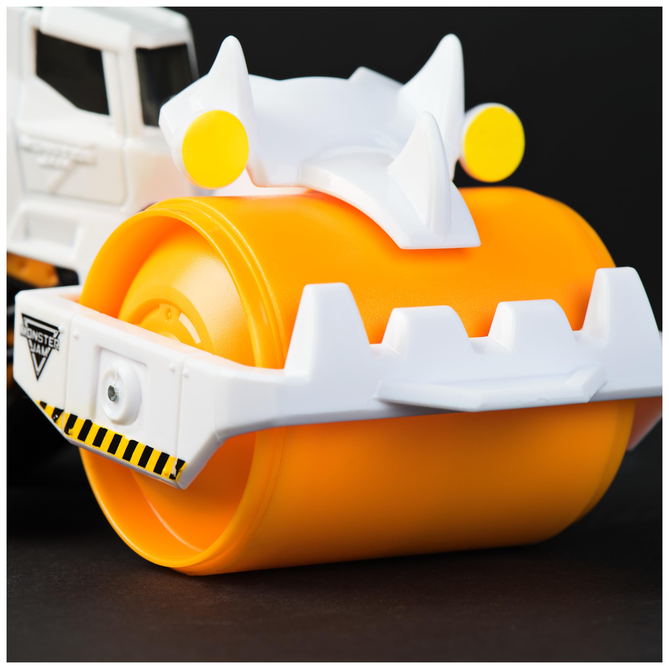 Monster Jam Dirt Squad tail-hook action lets kids tow trucks after a crash.