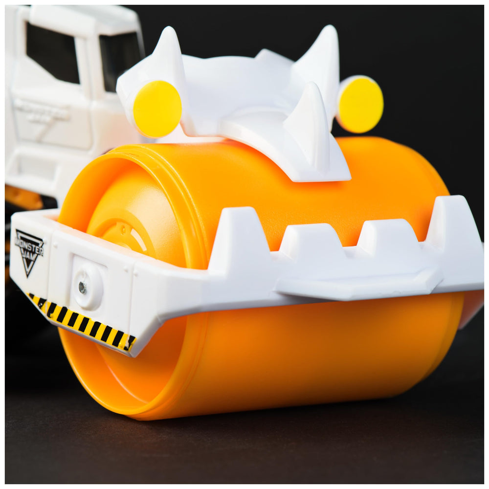 Monster Jam Dirt Squad tail-hook action lets kids tow trucks after a crash.