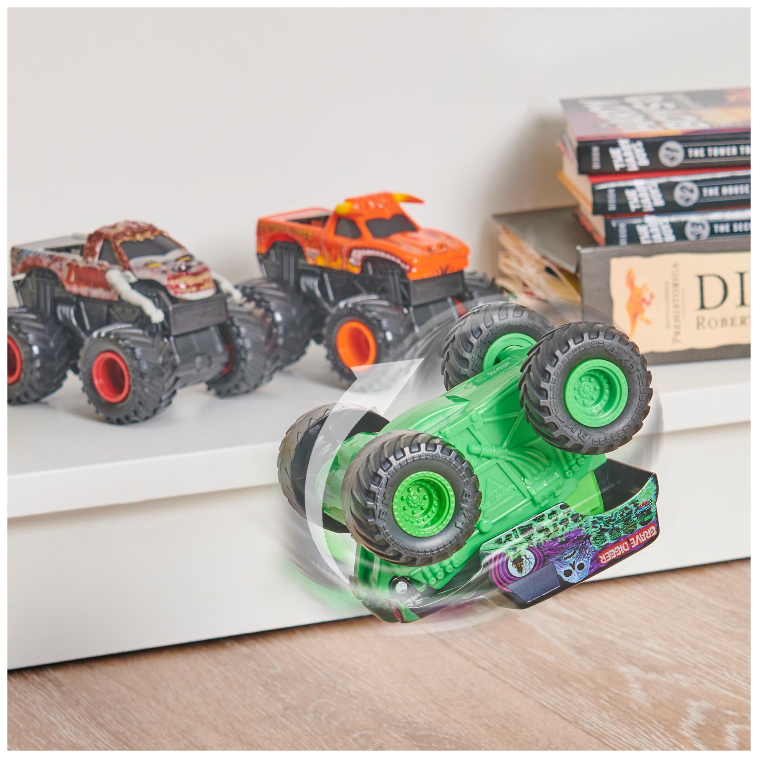 Monster Jam Grave Digger front flip action close-up shows bold colors and decals