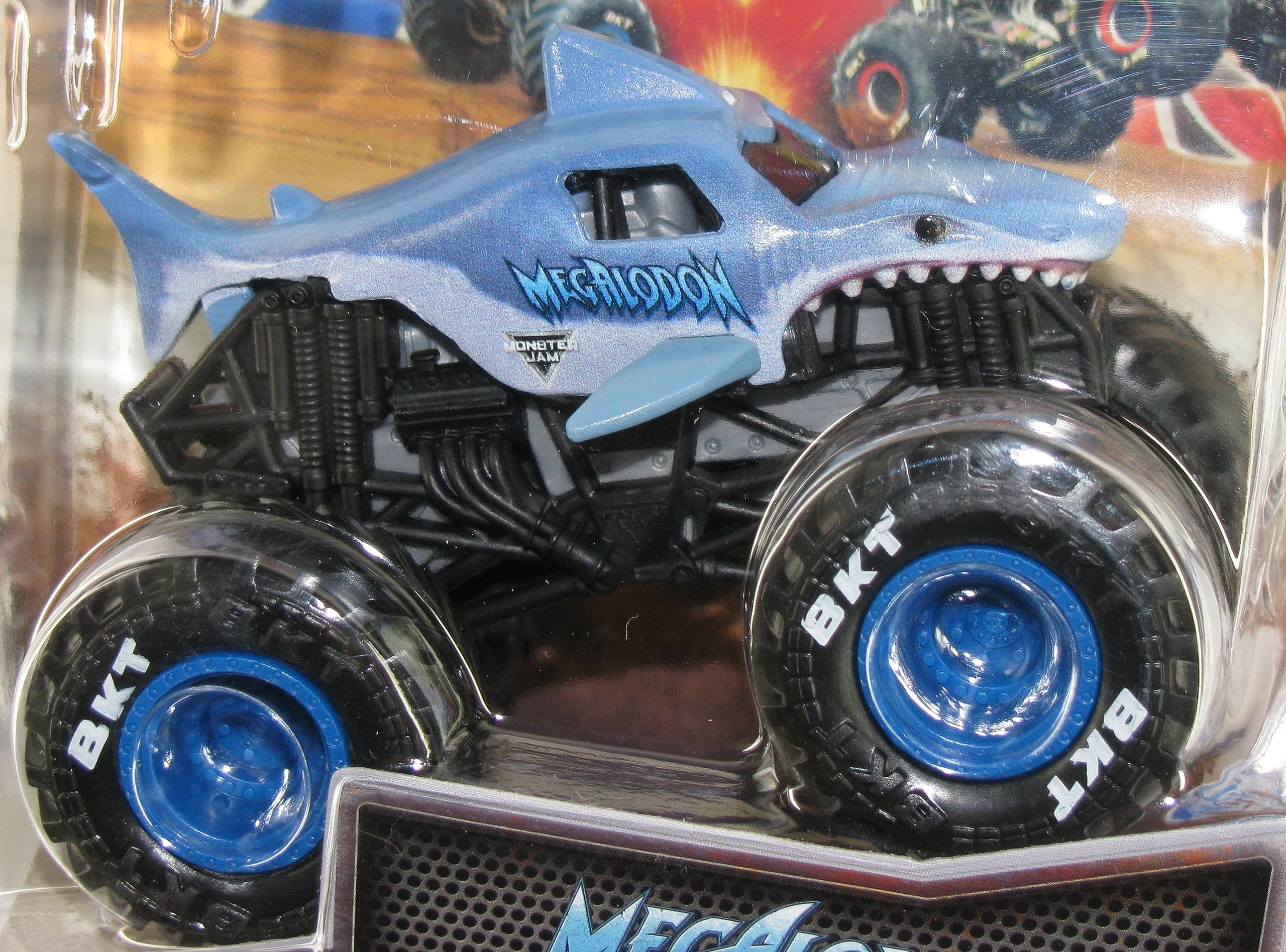 Monster Jam Megalodon 1:64 diecast truck side view highlights bold livery for display and collectability.