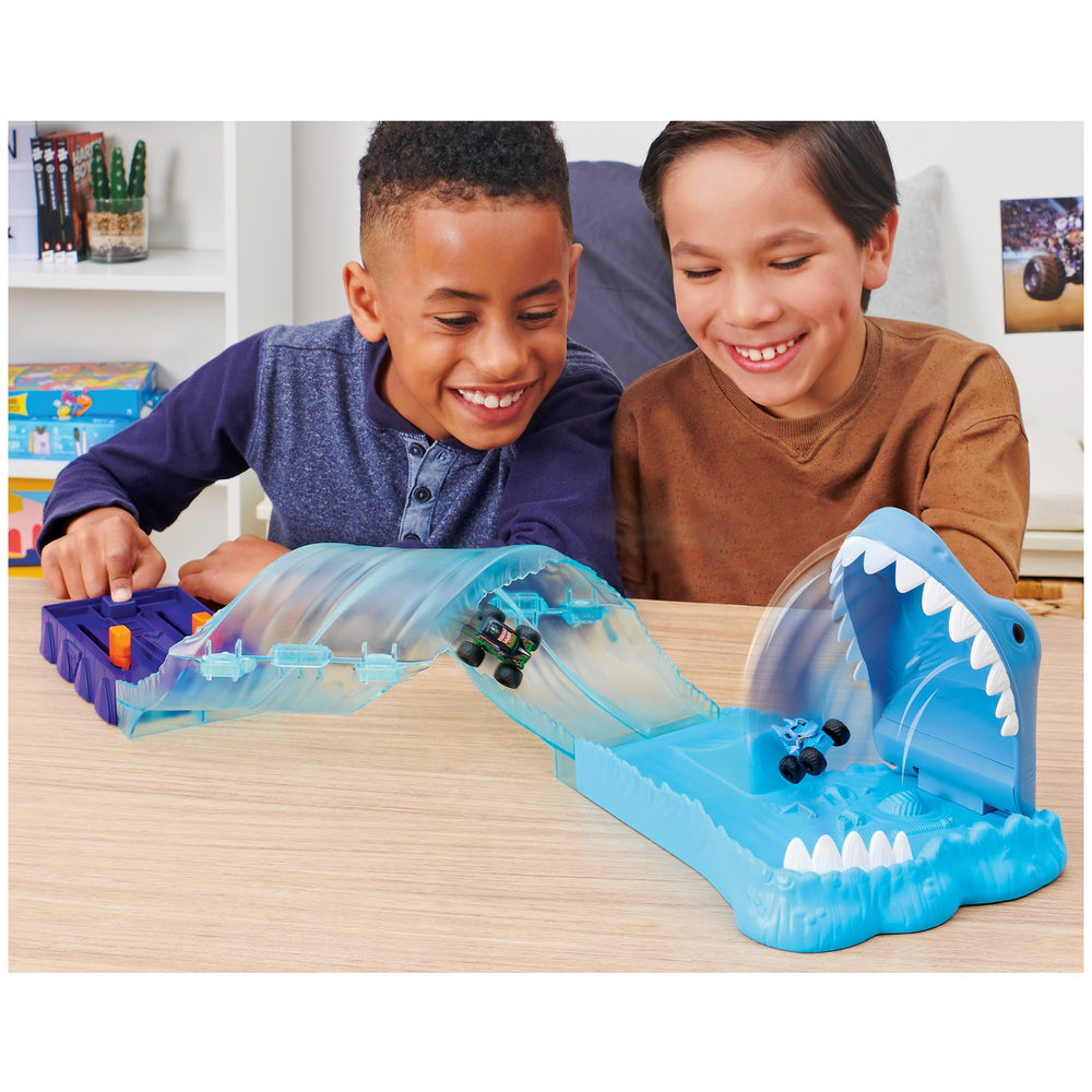 Monster Jam playset side view showing two exclusive trucks for imaginative racing fun
