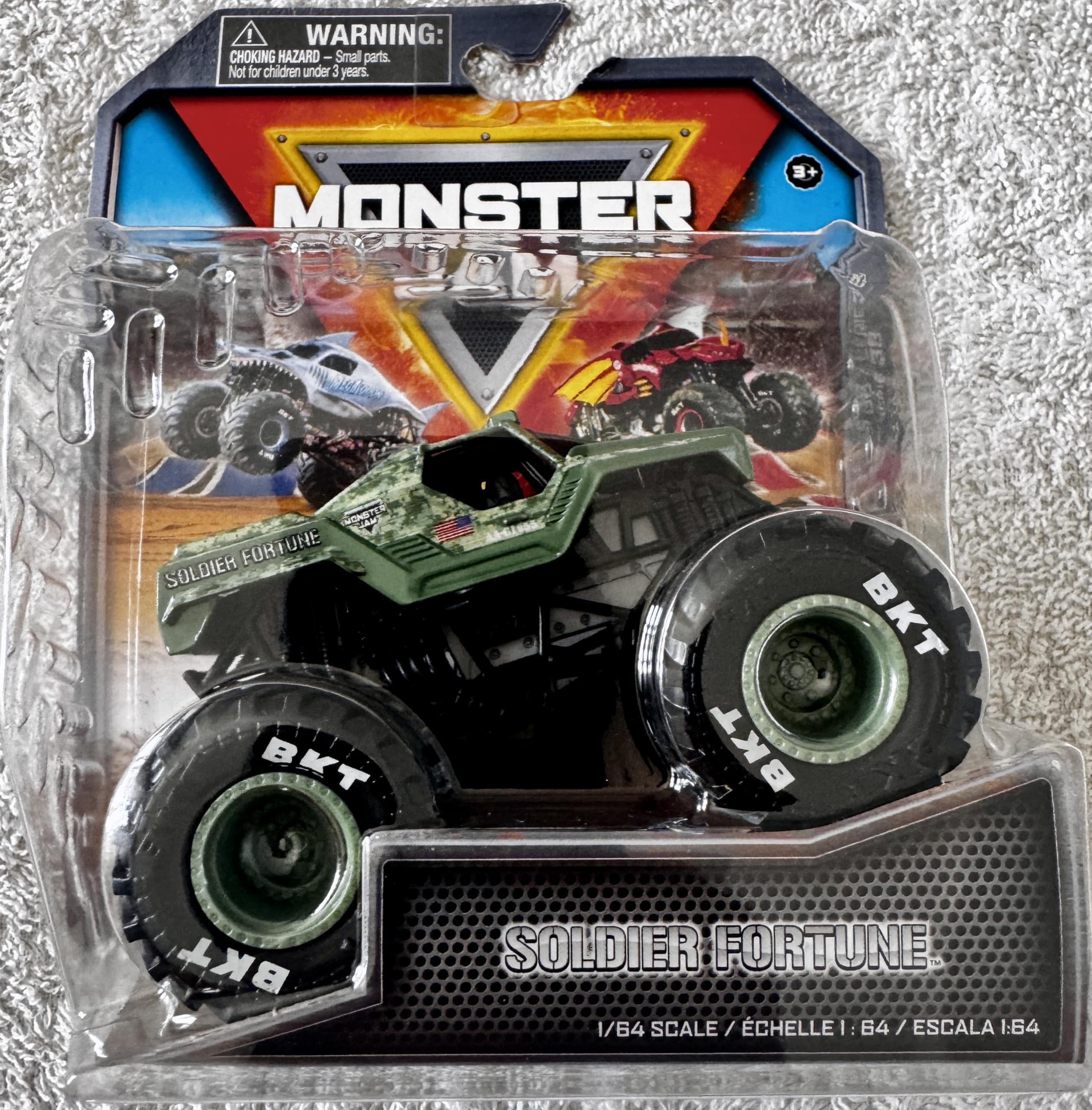 Monster Jam Soldier Fortune 1:64 die-cast truck front view showcases bold military graphics for display.