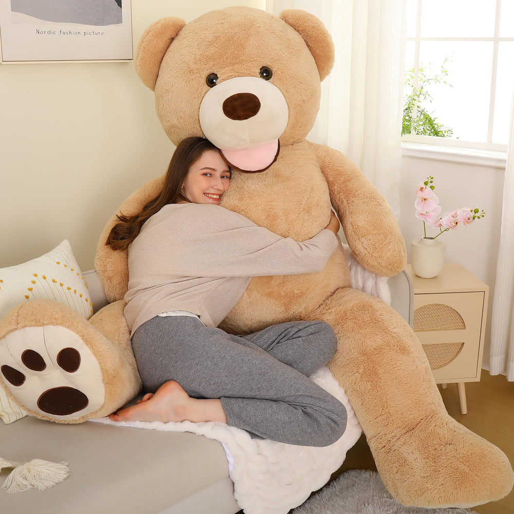 MorisMos 6ft giant teddy bear on bedside for cozy decor and hug-ready presence