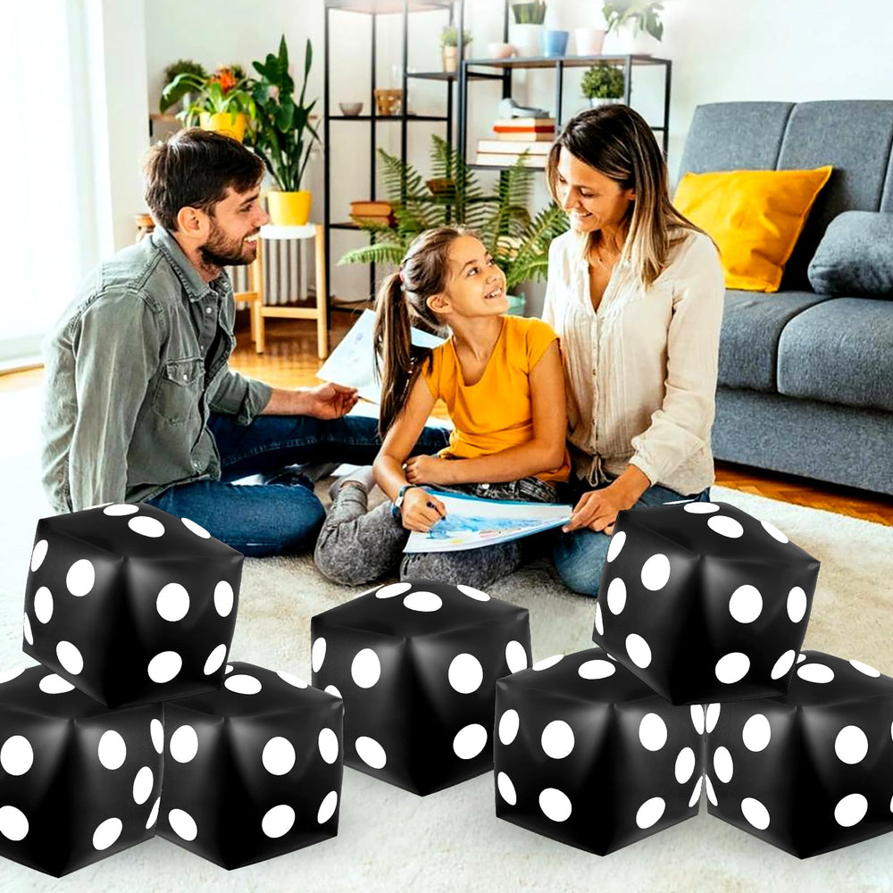Mototo backyard party setup with jumbo inflatable dice as decorations and games.