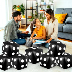 Mototo backyard party setup with jumbo inflatable dice as decorations and games.