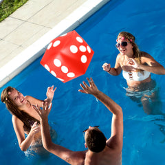 Mototo dice party setup with four colorful inflatable dice for celebrations and games.