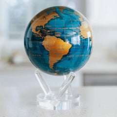 MOVA globe close-up shows cerulean oceans and gold continents with a soft glow