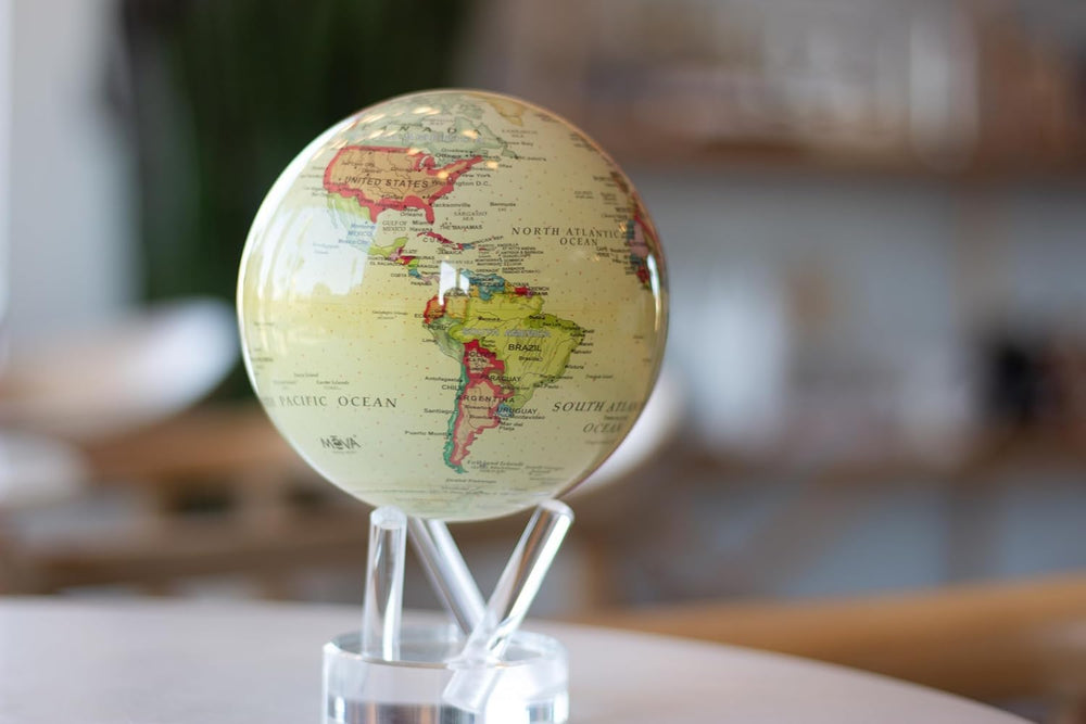 MOVA Globe displayed in a library or office setting