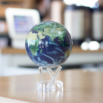 MOVA Globe silent rotation under office lighting provides a tranquil, distraction-free view.