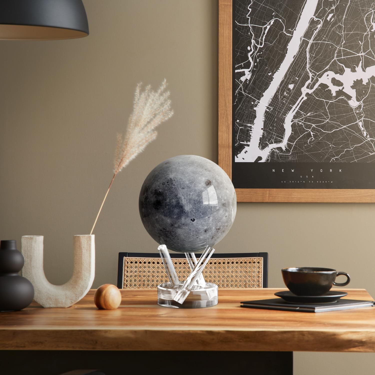 MOVA Moon Globe rotates under ambient light with magnetic-field assist.