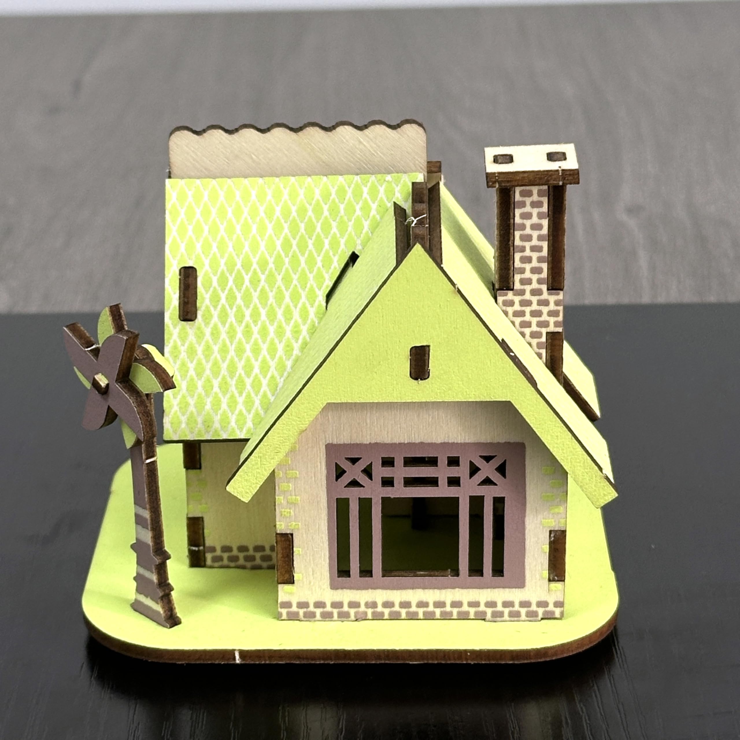 MPIUET green tiny house pieces aligned for patient, satisfying building sessions.