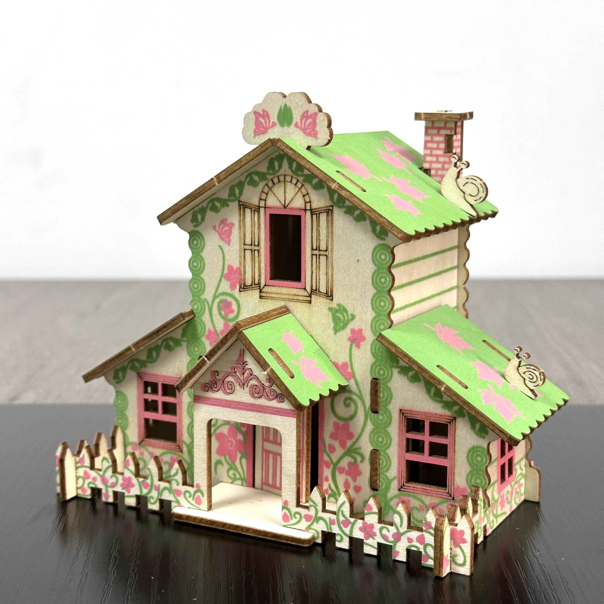 MPIUET forest cabin puzzle instruction sheet and pieces aligned