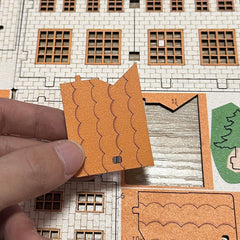 MPIUET Yellow House 9-in-1 unboxed layout shows preparation for DIY project