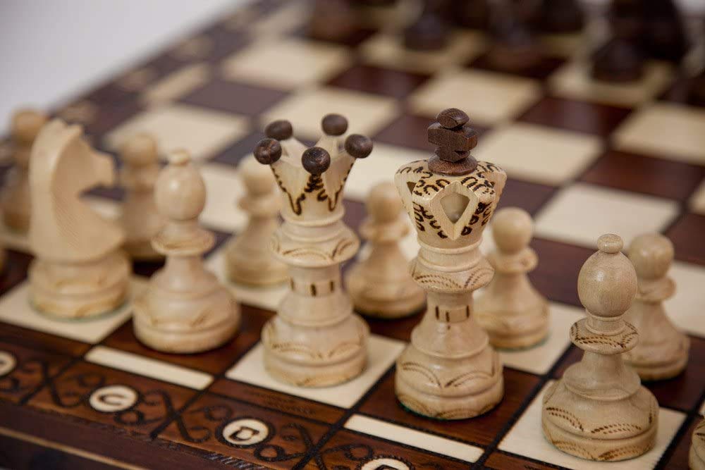 Muba carved hornbeam and sycamore chess pieces with weighted bases for balanced play.