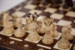 Muba carved hornbeam and sycamore chess pieces with weighted bases for balanced play.
